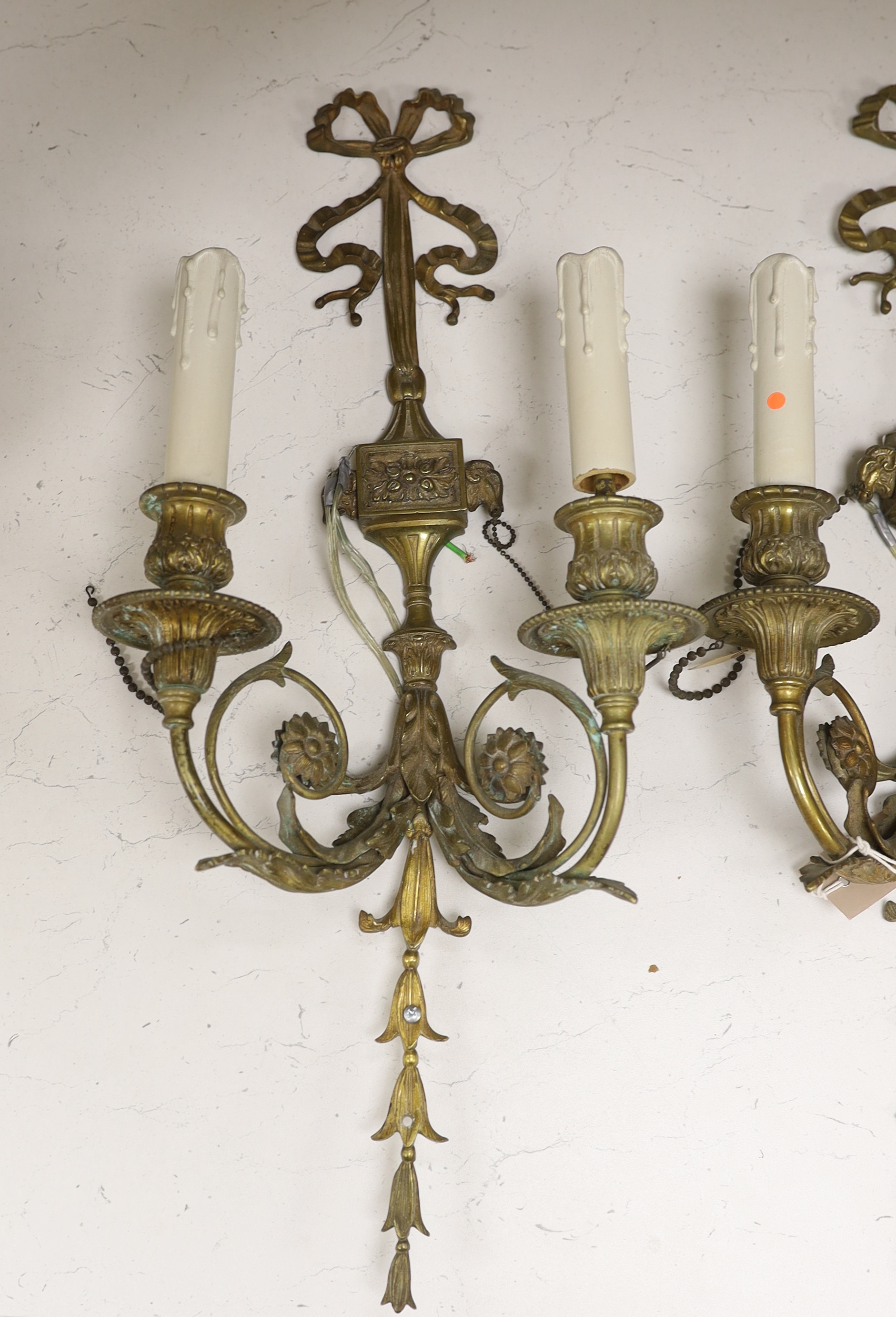 A pair of French Louis XVI style two branch ormolu wall lights, 60cm high